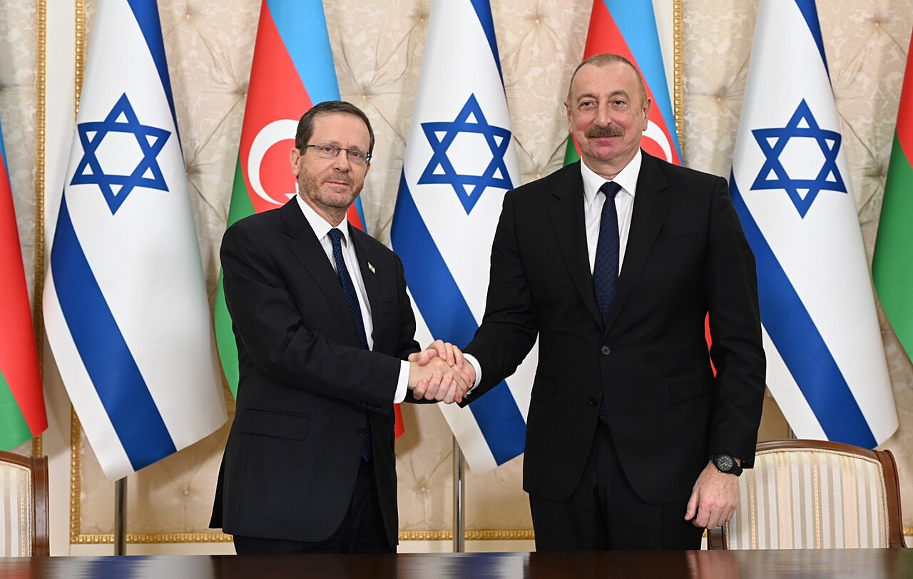Herzog and Aliyev shake hands in Baku in May 2023
